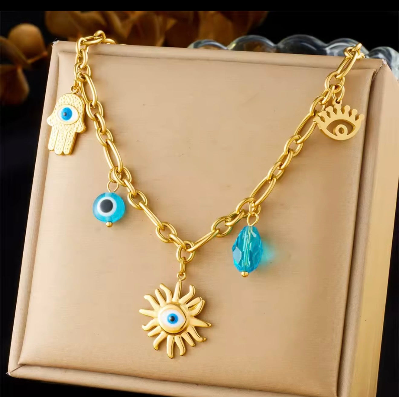 Collares  de acero inoxidable  con dijes de sol,luna,ojo,perlas,