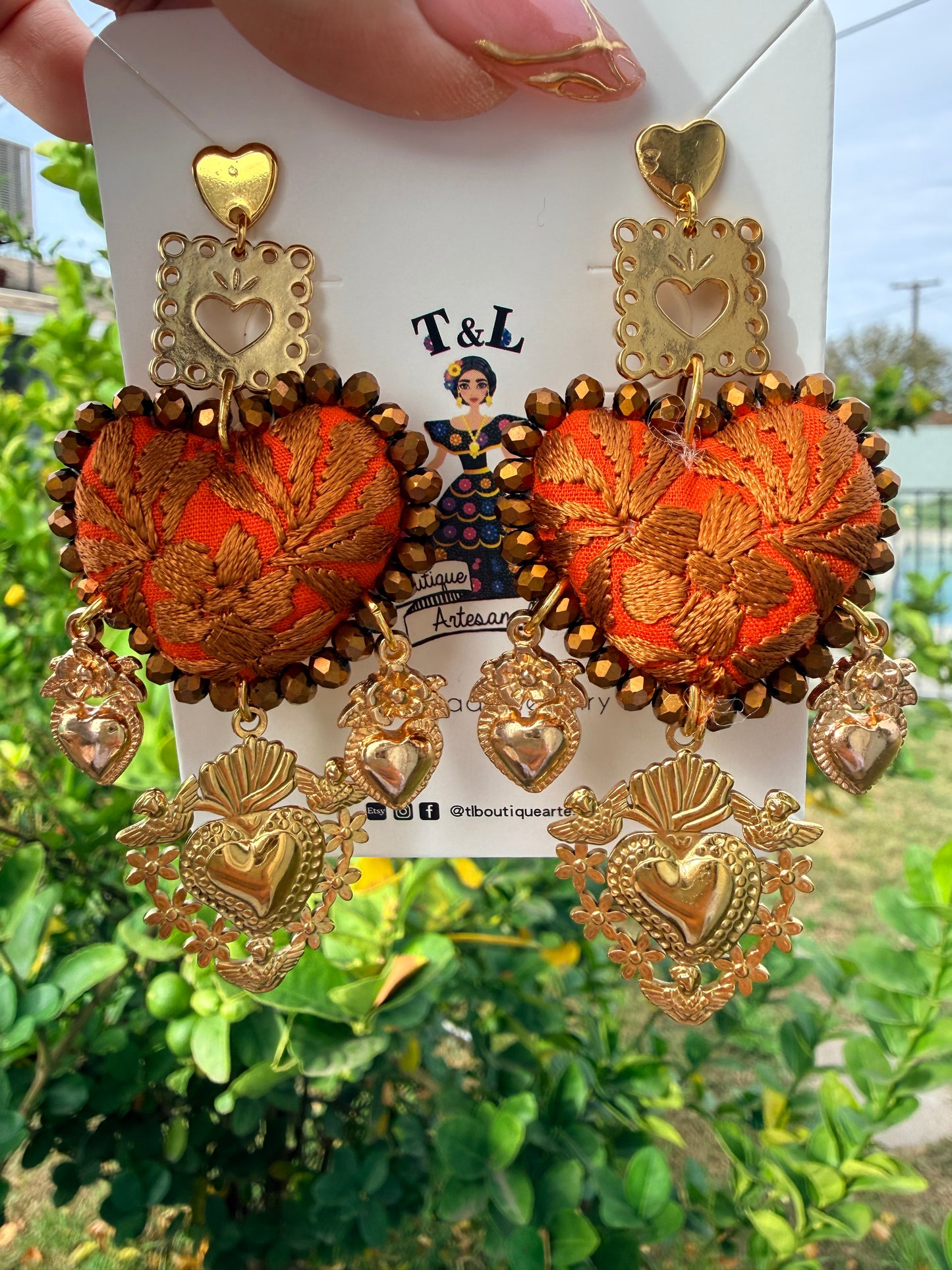 Aretes Bordados a Mano :Naranja – Cristales Dorados, Sagrado Corazón y Papel Picado/ hand made jewelry