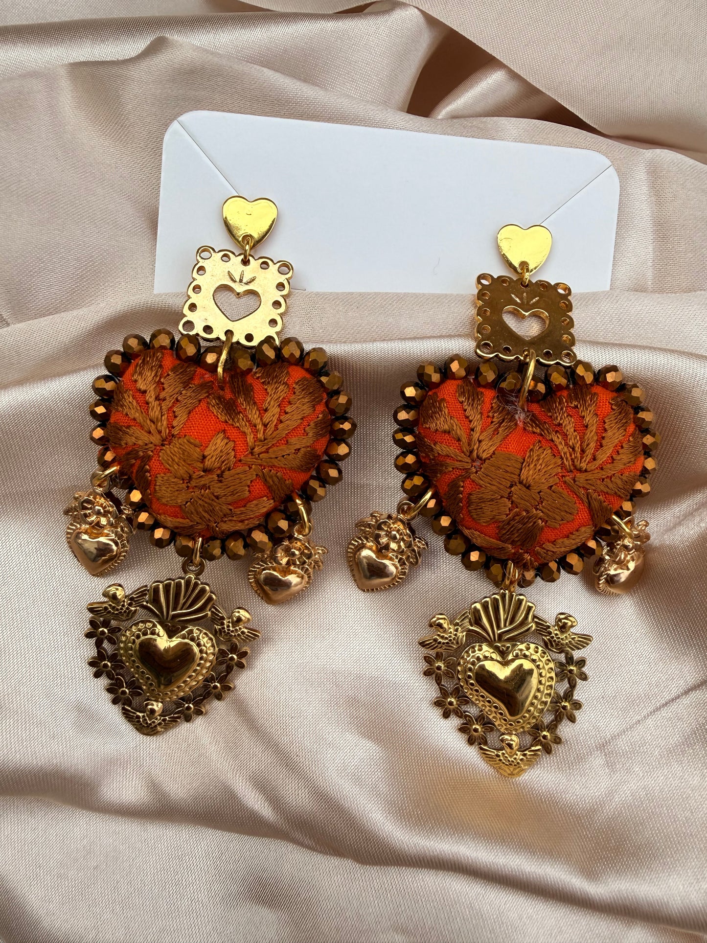 Aretes Bordados a Mano :Naranja – Cristales Dorados, Sagrado Corazón y Papel Picado/ hand made jewelry