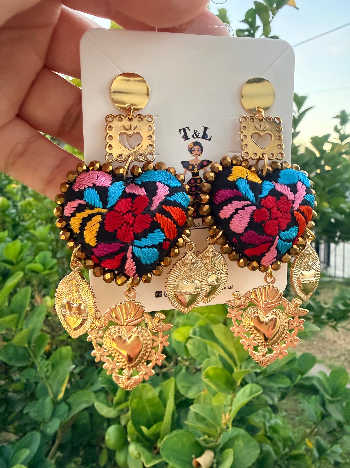 Aretes Bordados a Mano :Naranja – Cristales Dorados, Sagrado Corazón y Papel Picado/ hand made jewelry